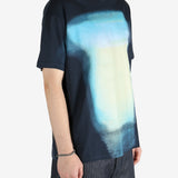 Blue t-shirt worn by a person, showing the shirt fit