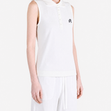 White top worn by a person, showing the top fit