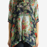 Green top worn by a person, showing the top fit