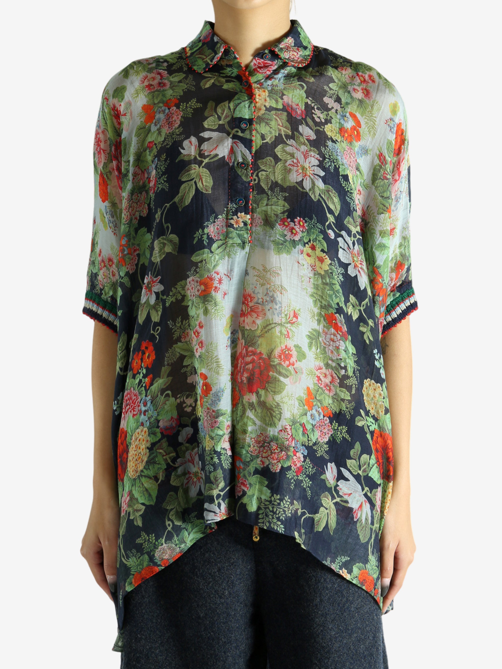 Green top worn by a person, showing the top fit