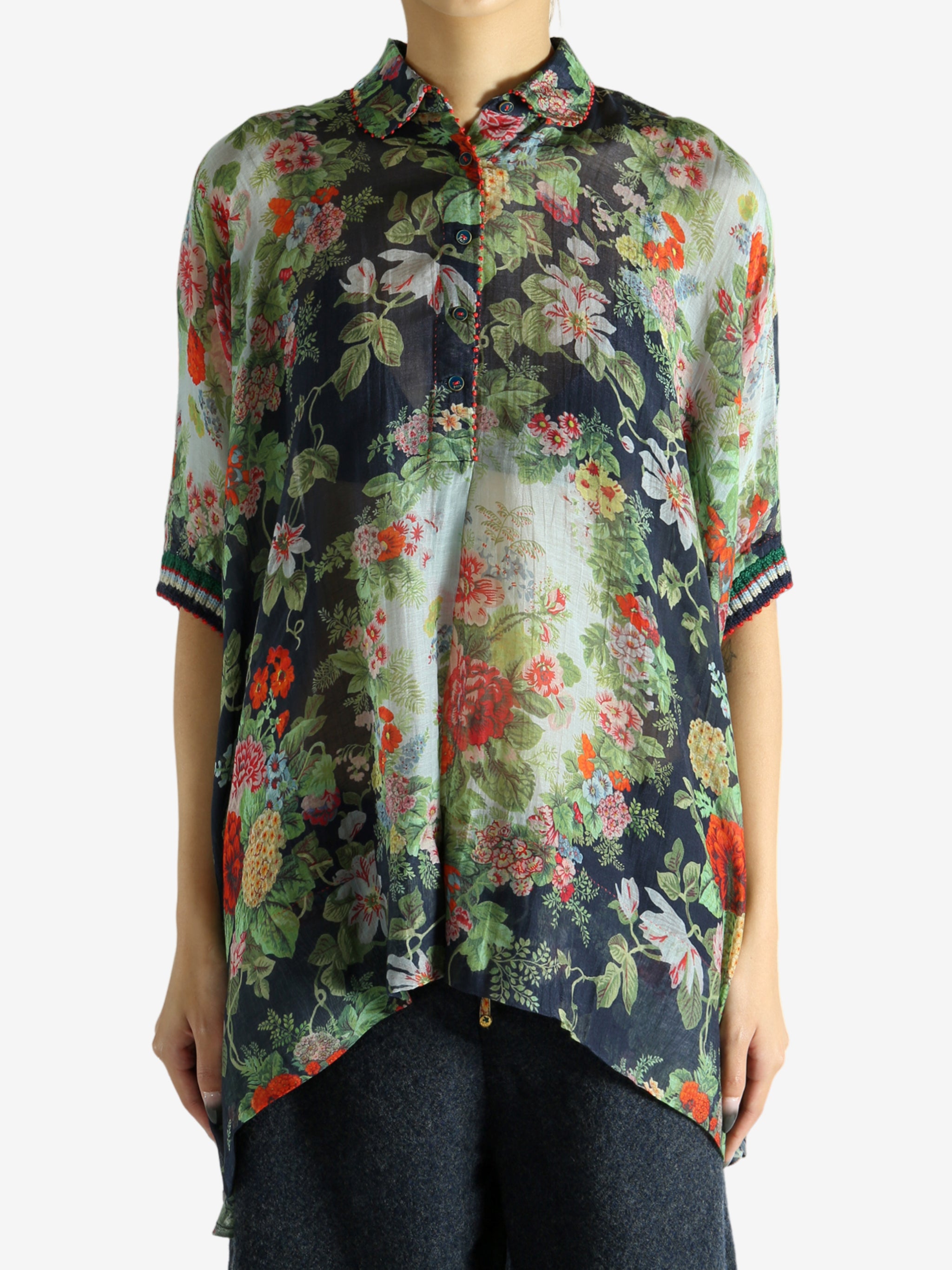 Green top worn by a person, showing the top fit