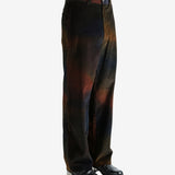 Black pants worn by a person, showing the pants's fit