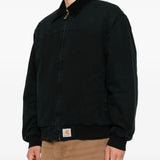 Black jacket worn by a person, showing the jacket fit