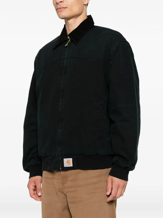 Black jacket worn by a person, showing the jacket fit