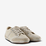 Tan sneakers, side view