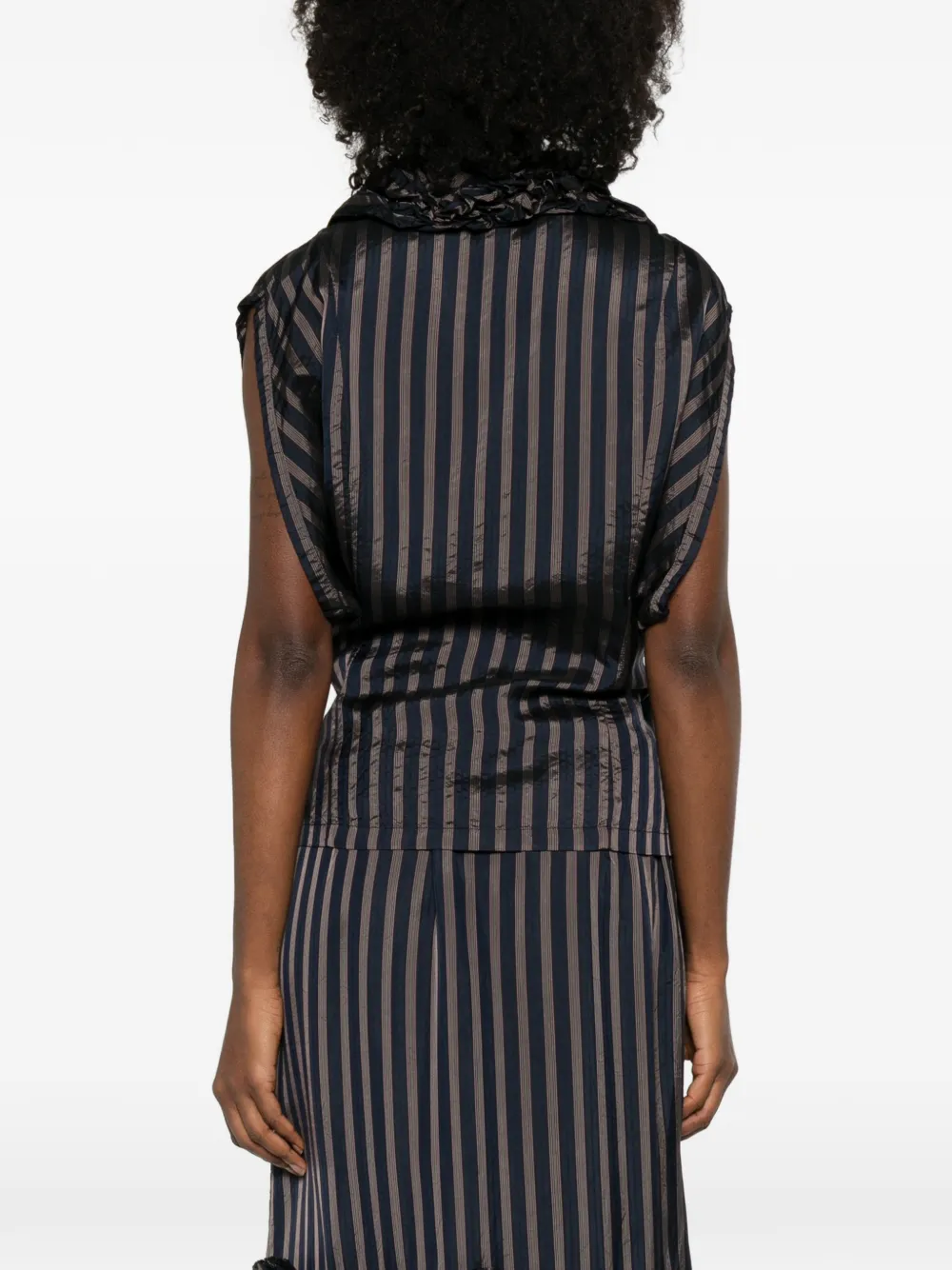 black shirts worn by a person, showing the shirts fit