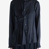 Black top worn by a person, showing the top's fit