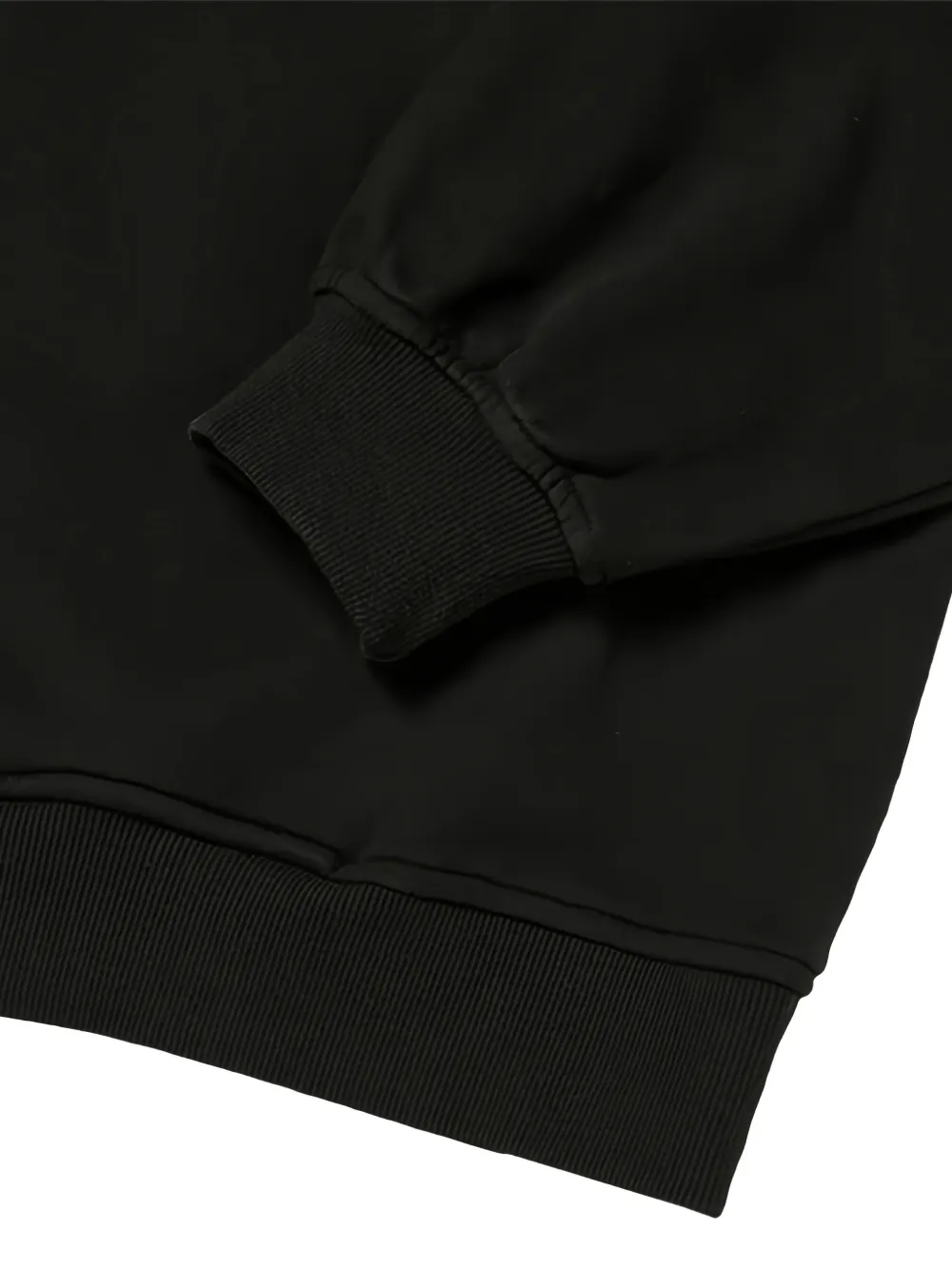 Close up of black hoodie, showing texture of the Cotton fabric