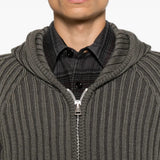 Grey hoodie worn by a person, showing the hoodie fit