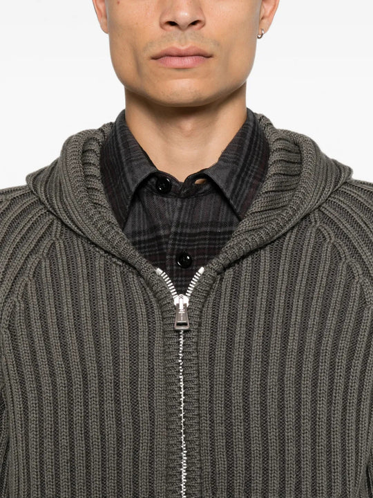 Grey hoodie worn by a person, showing the hoodie fit