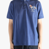Blue polo shirt worn by a person, showing the shirt's fit