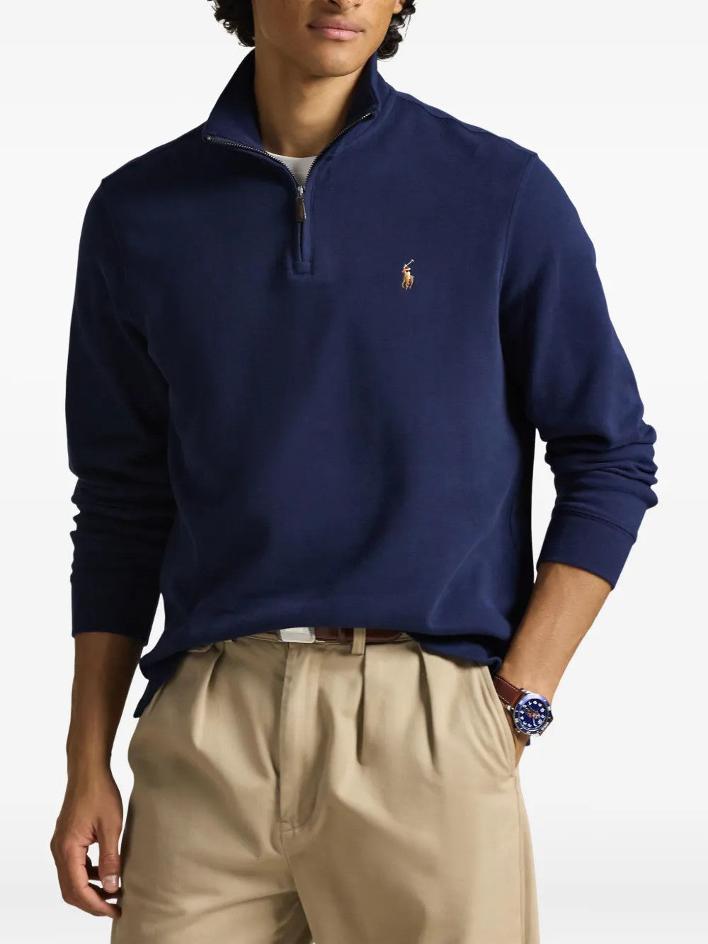 Navy knitwear worn by a person, showing the knitwear fit