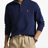 Navy knitwear worn by a person, showing the knitwear fit