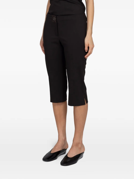 Brown pants worn by a person, showing the pants' fit