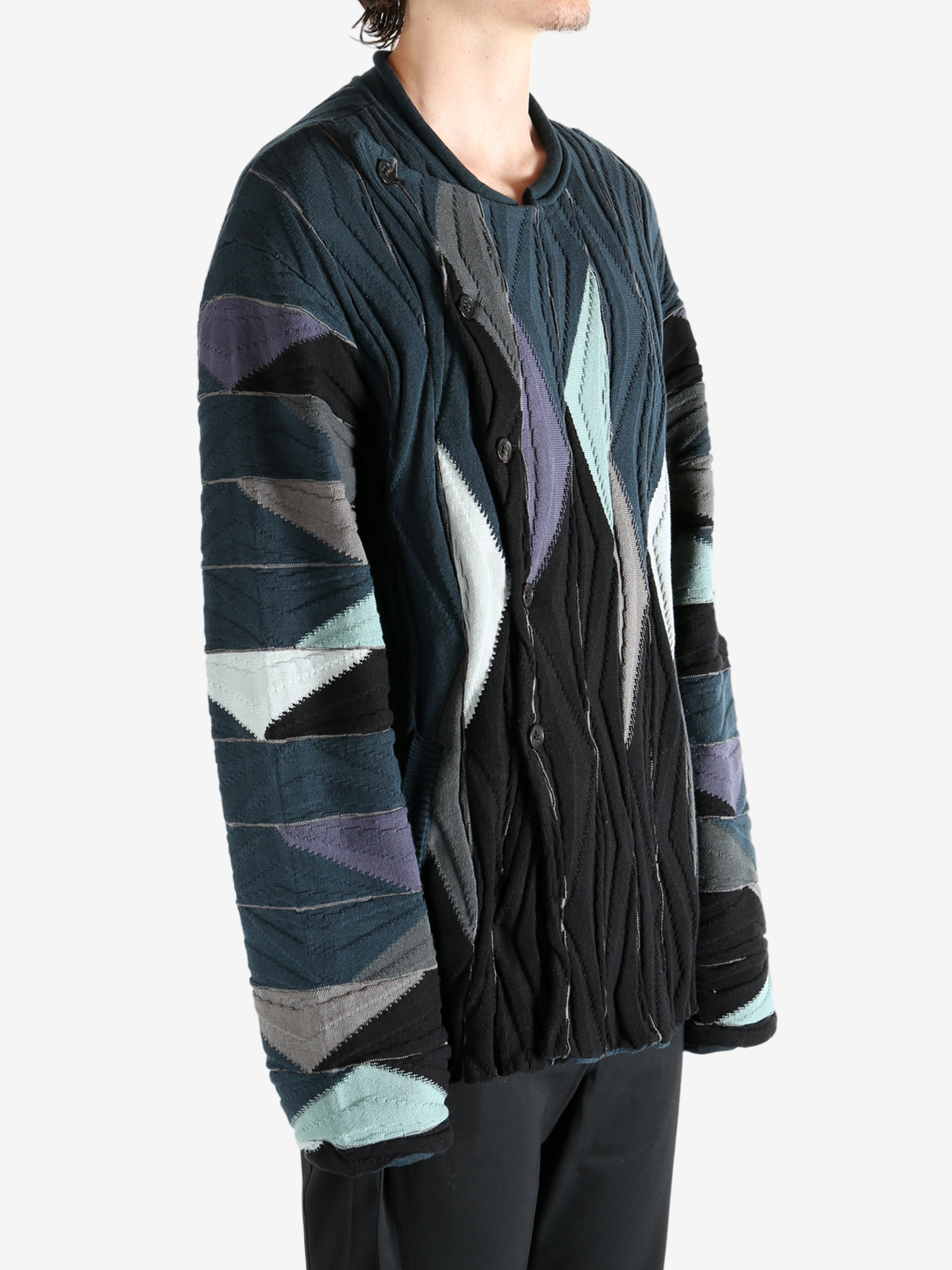 Black top worn by a person, showing the top's fit