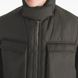 Close up of the brown coat, showing texture of the polyamide fabric