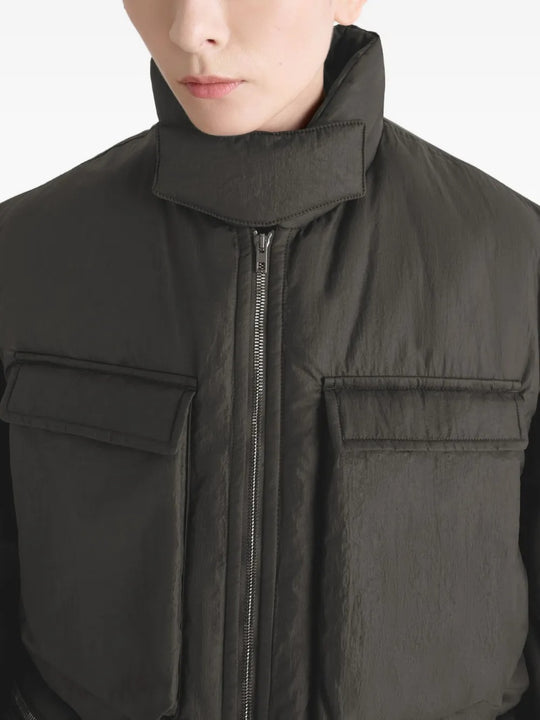 Close up of the brown coat, showing texture of the polyamide fabric