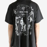 Black t-shirt worn by a person, showing the t-shirt's fit