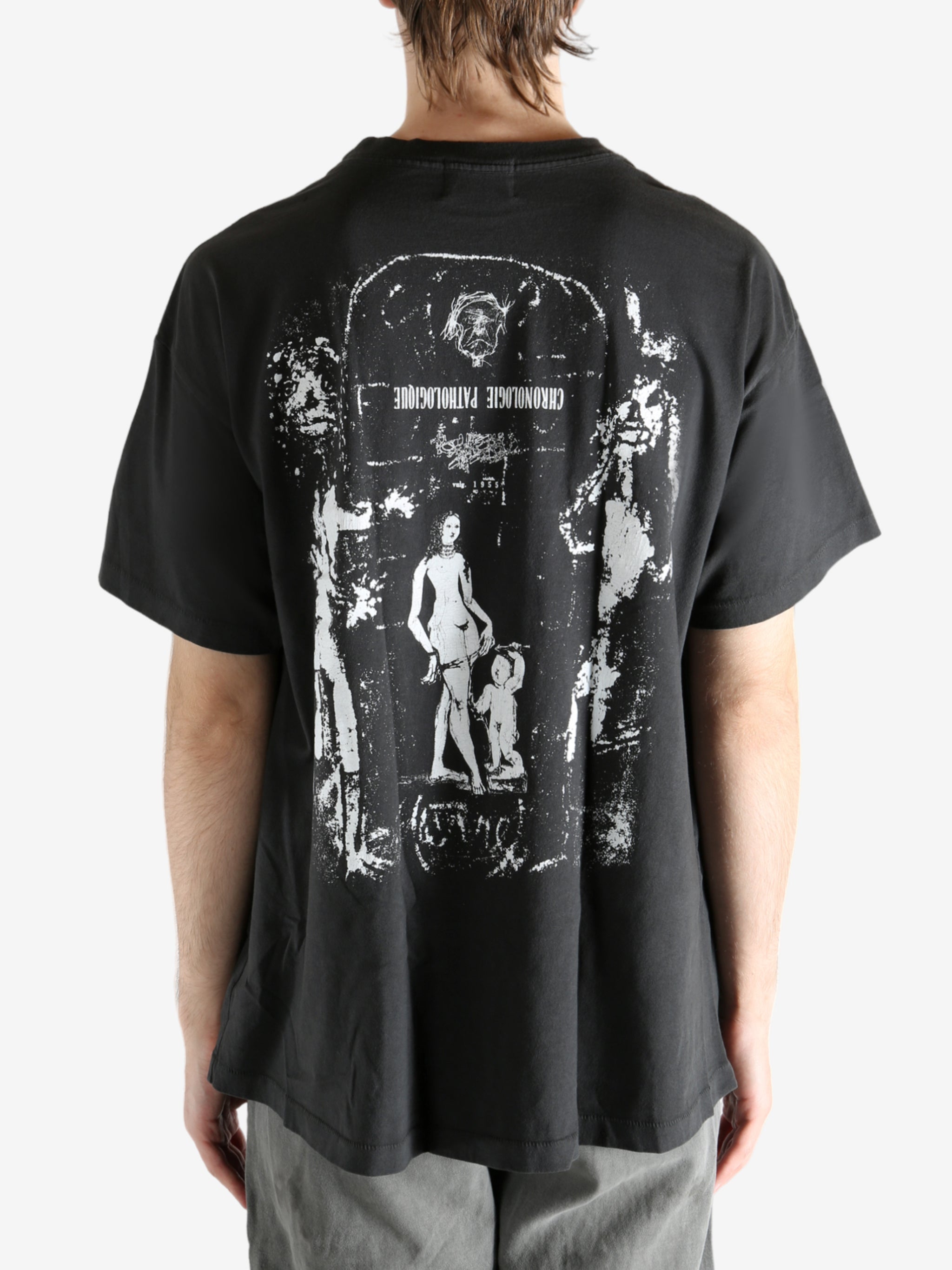 Black t-shirt worn by a person, showing the t-shirt's fit