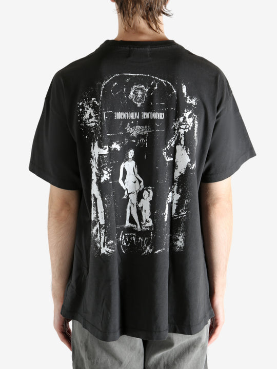 Black t-shirt worn by a person, showing the t-shirt's fit