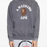 Grey knitwear worn by a person, showing the knitwear fit