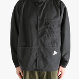 Black jacket worn by a person, showing the jacket's fit