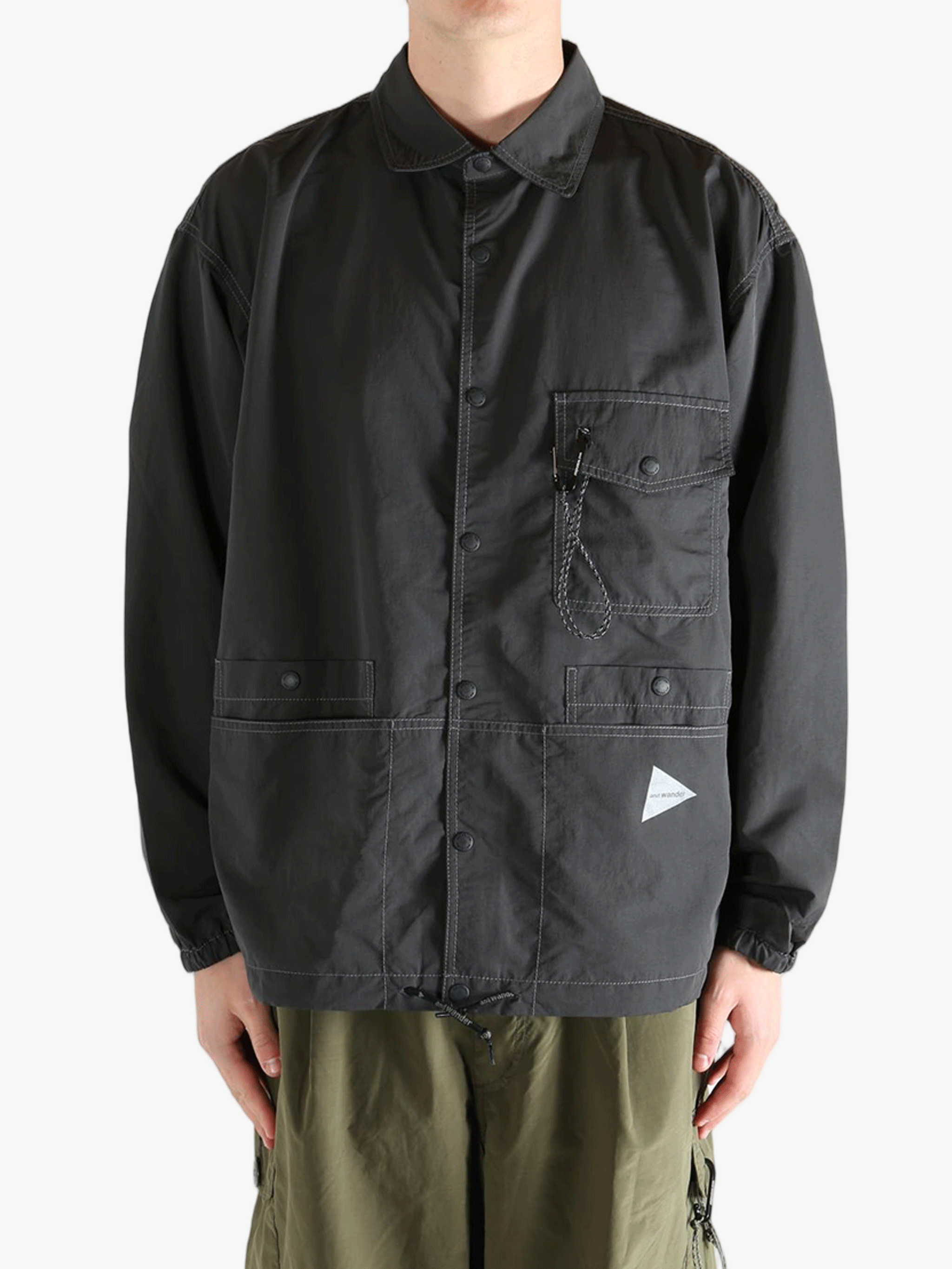 Black jacket worn by a person, showing the jacket's fit