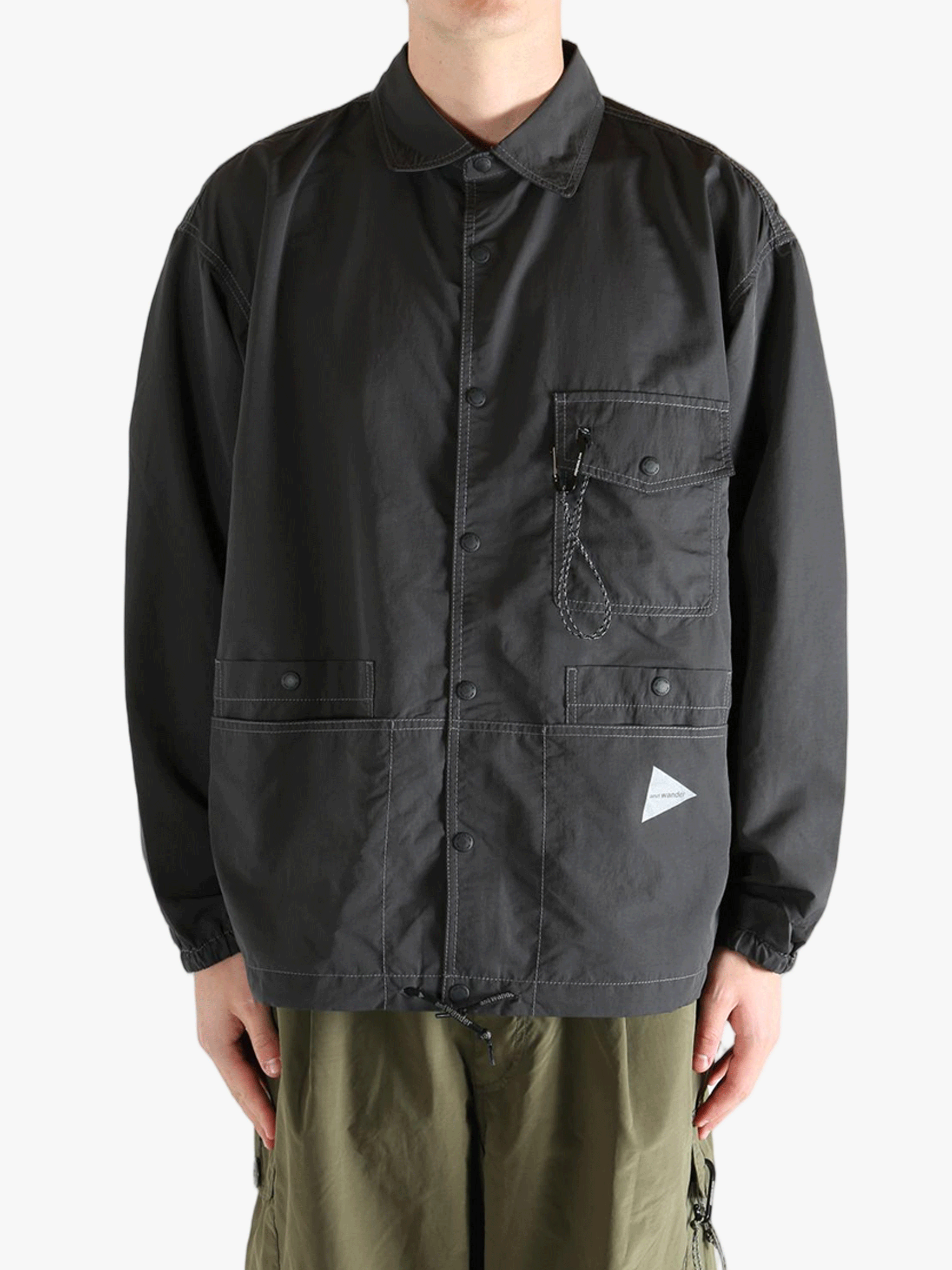 Black jacket worn by a person, showing the jacket's fit