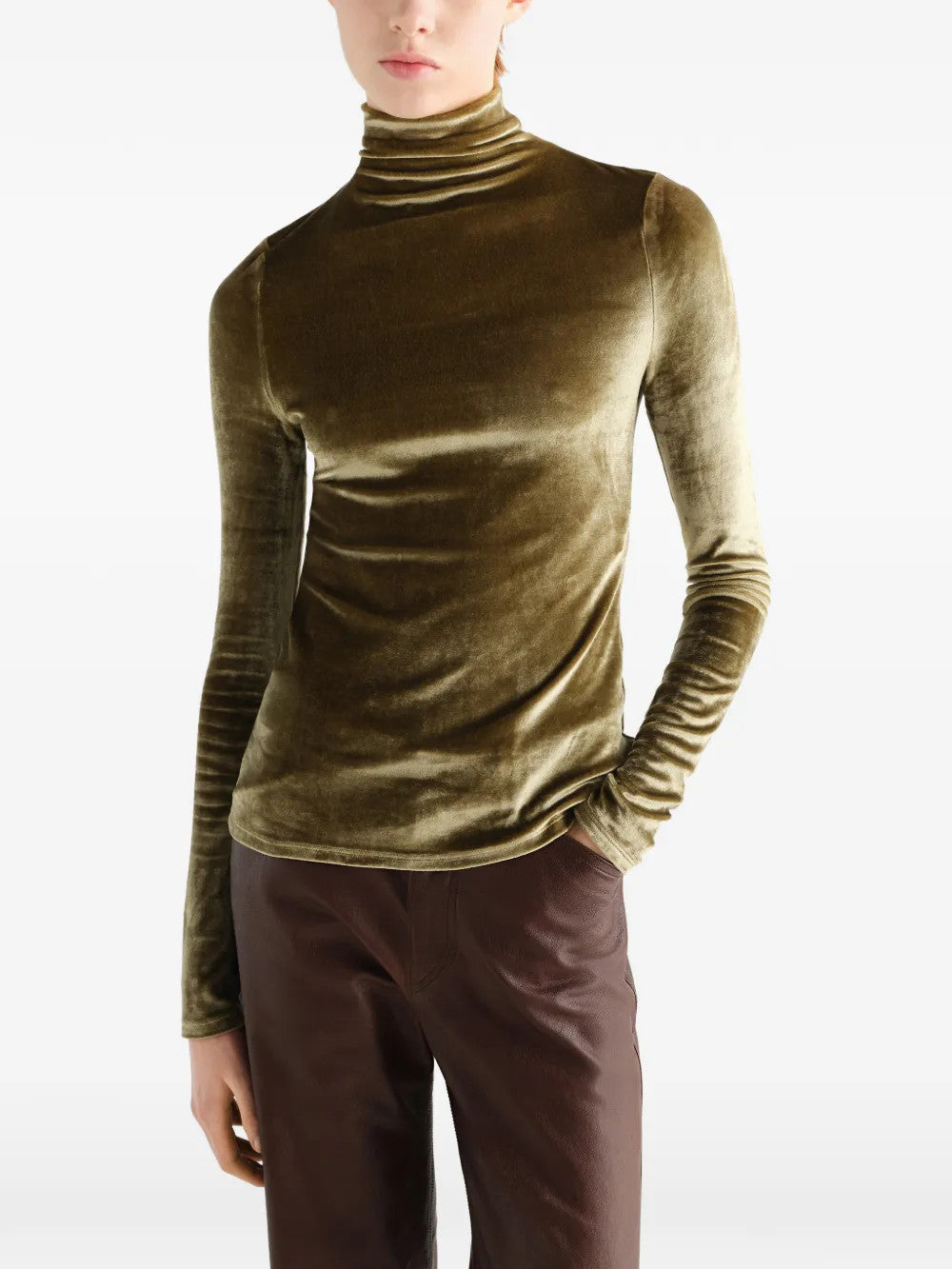 Green top worn by a person, showing the top fit