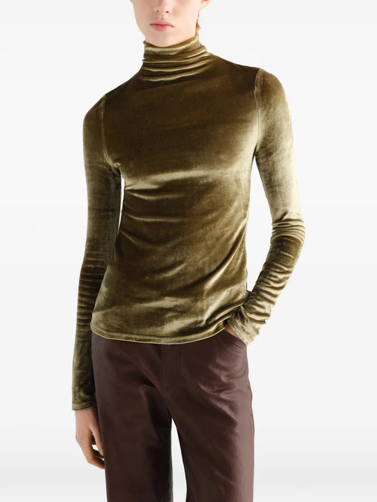 Green top worn by a person, showing the top fit