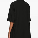 Black t-shirt worn by a person, showing the t-shirt fit