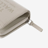 Close up of tan bag, showing texture of the leather fabric