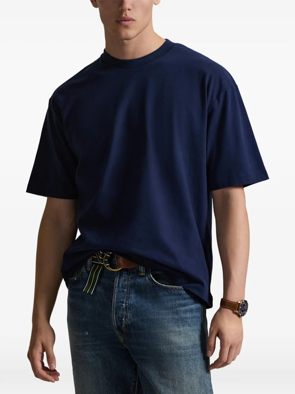 Navy T-shirt worn by a person, showing the shirt's fit