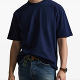 Navy T-shirt worn by a person, showing the shirt's fit