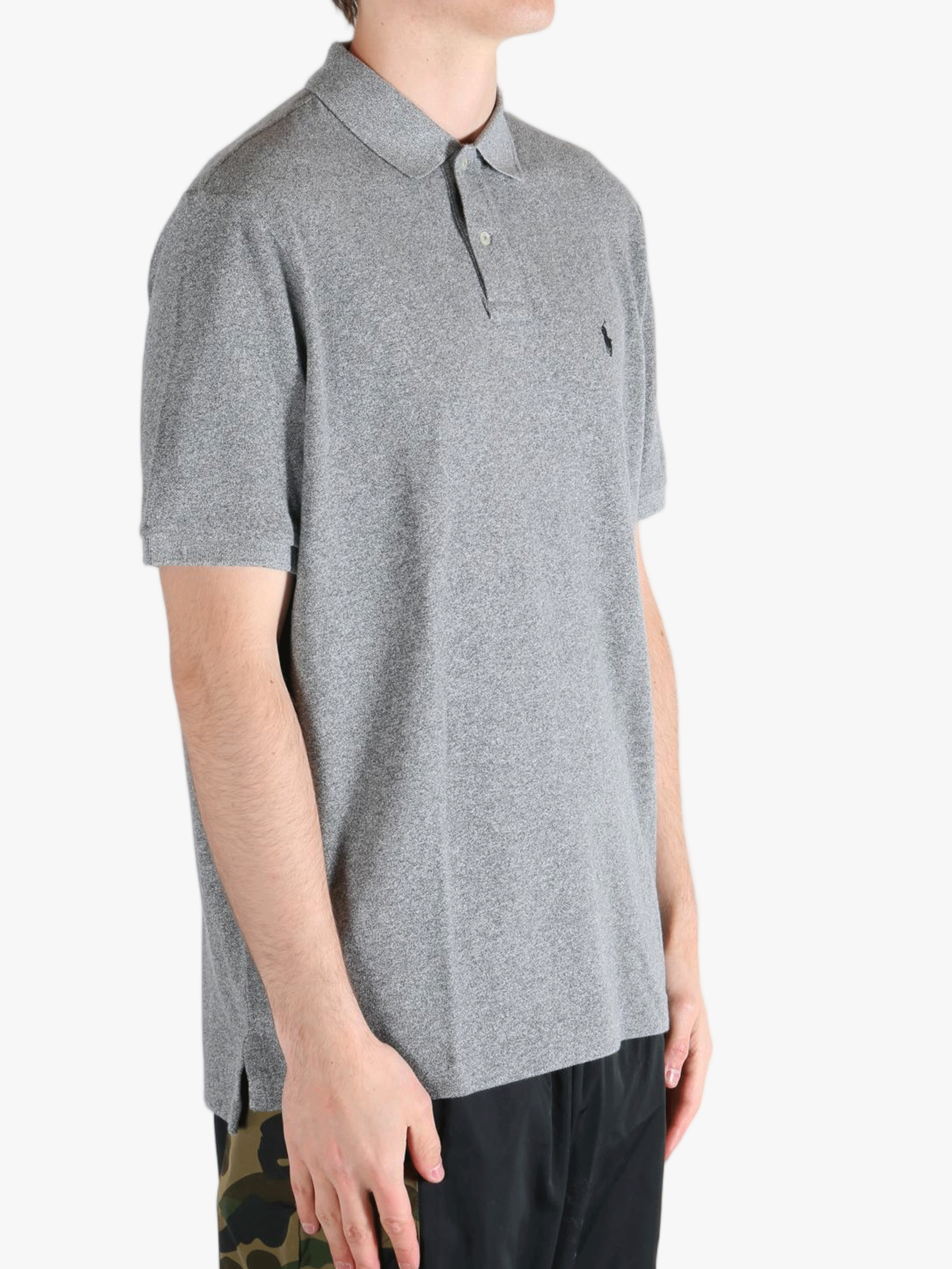 Grey t-shirt worn by a person, showing the t-shirt's fit