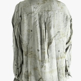 Green shirt worn by a person, showing the shirt's fit