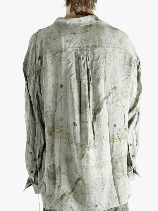 Green shirt worn by a person, showing the shirt's fit