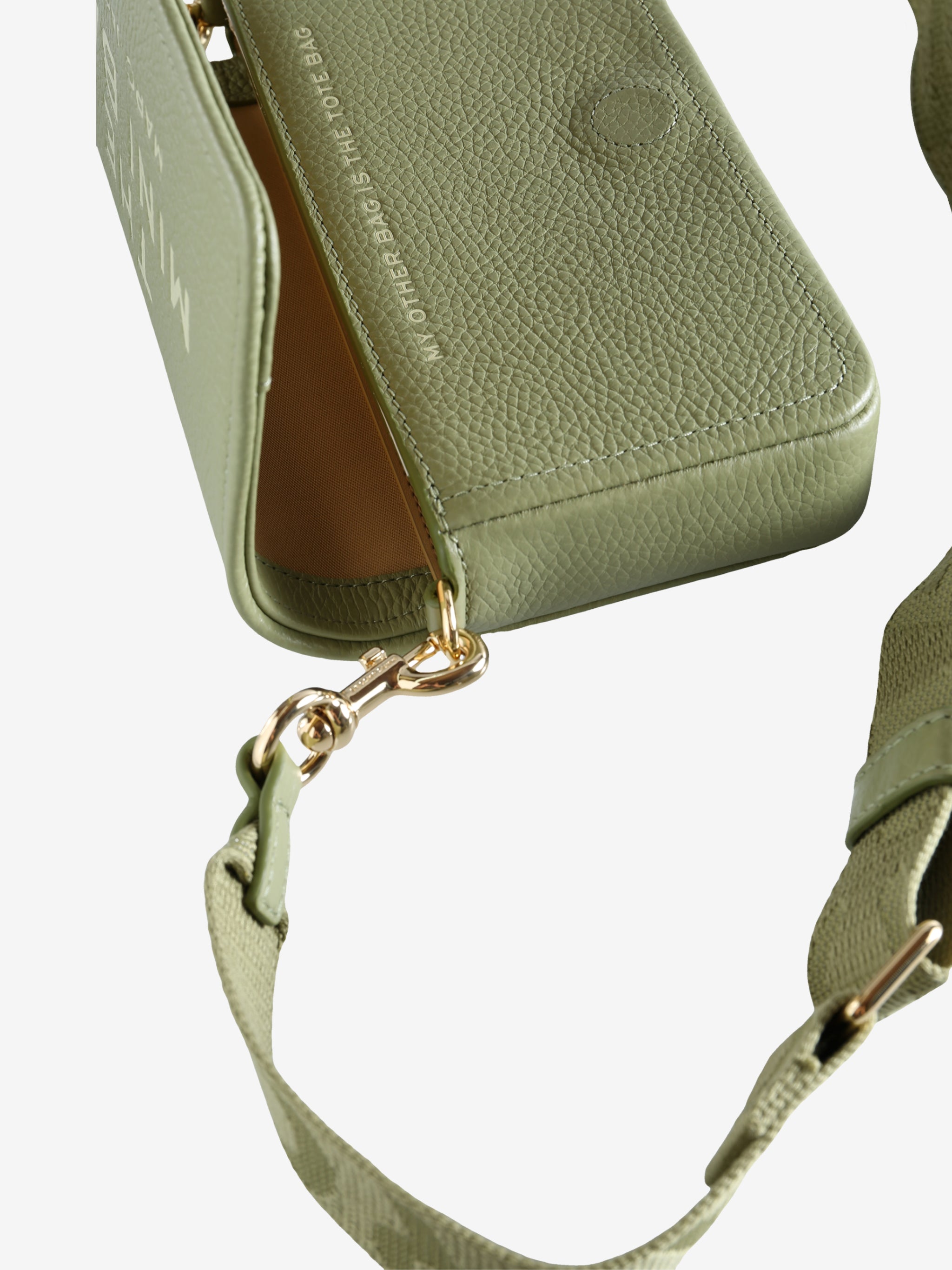 Close up of green bag, showing texture of the leather fabric