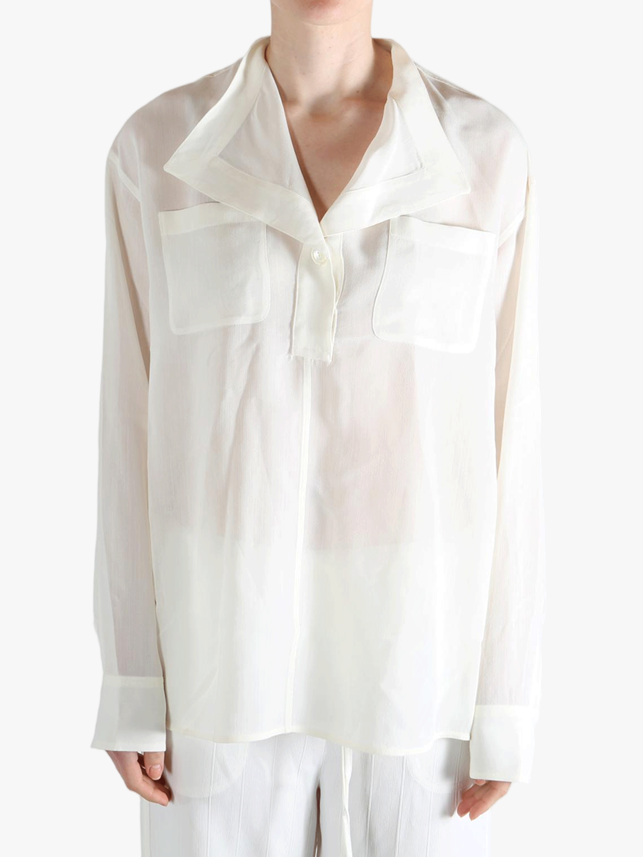 white shirts worn by a person, showing the shirts fit