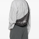 grey bag worn by a person, showing the bag's fit