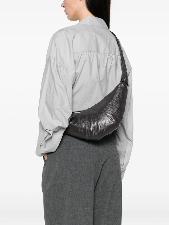 grey bag worn by a person, showing the bag's fit