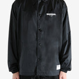 Black jackets worn by a person, showing the jackets fit