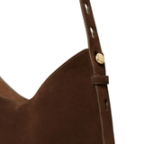 close up of brown bags, showing texture of the suede fabric
