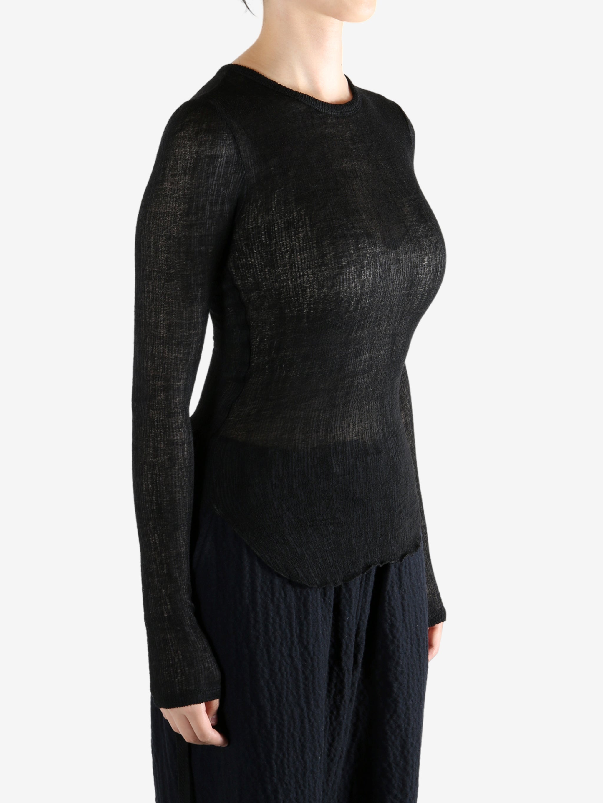 Black topworn by a person, showing the top fit