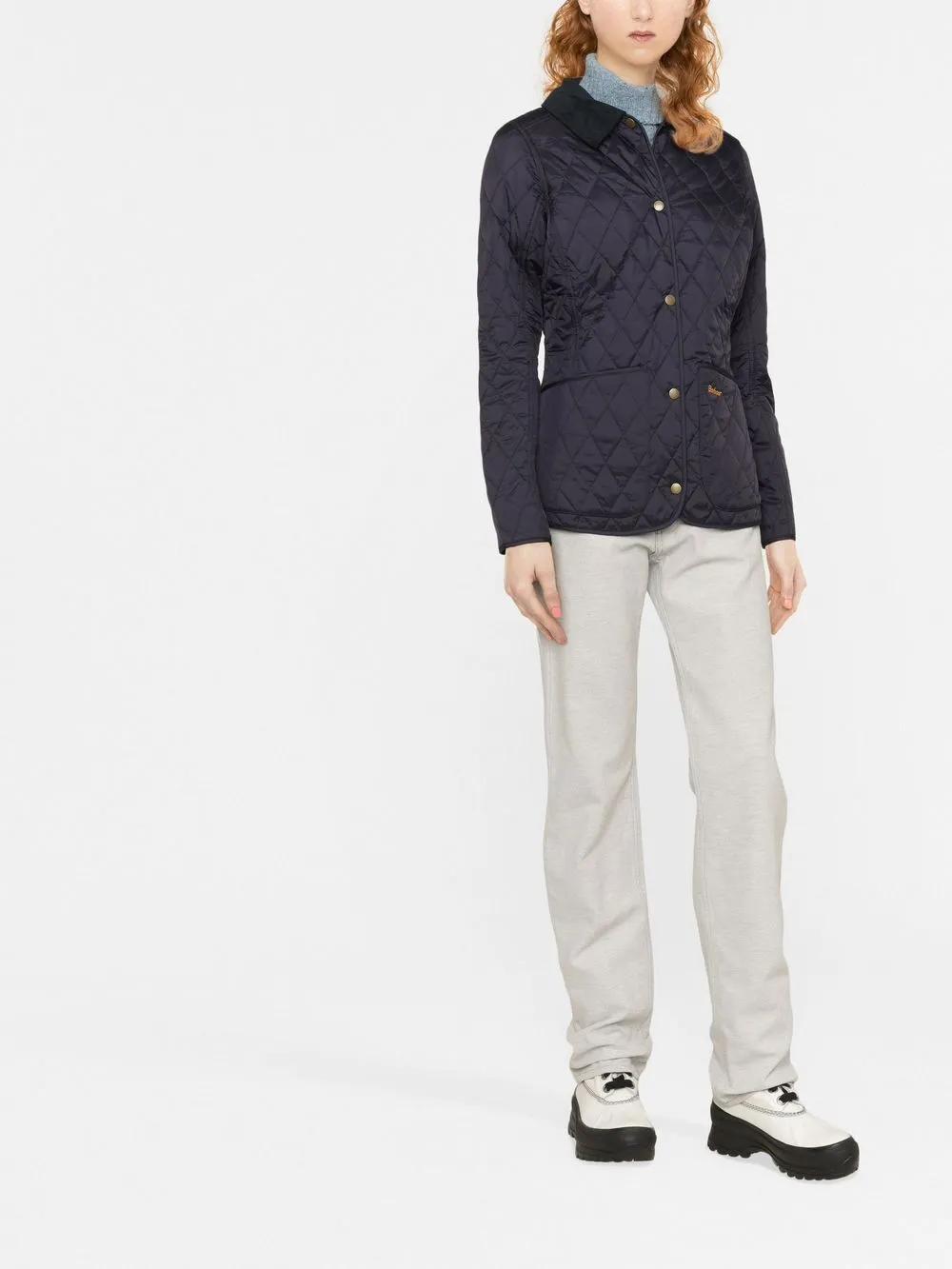 Navy jacket worn by a person, showing the jacket's fit