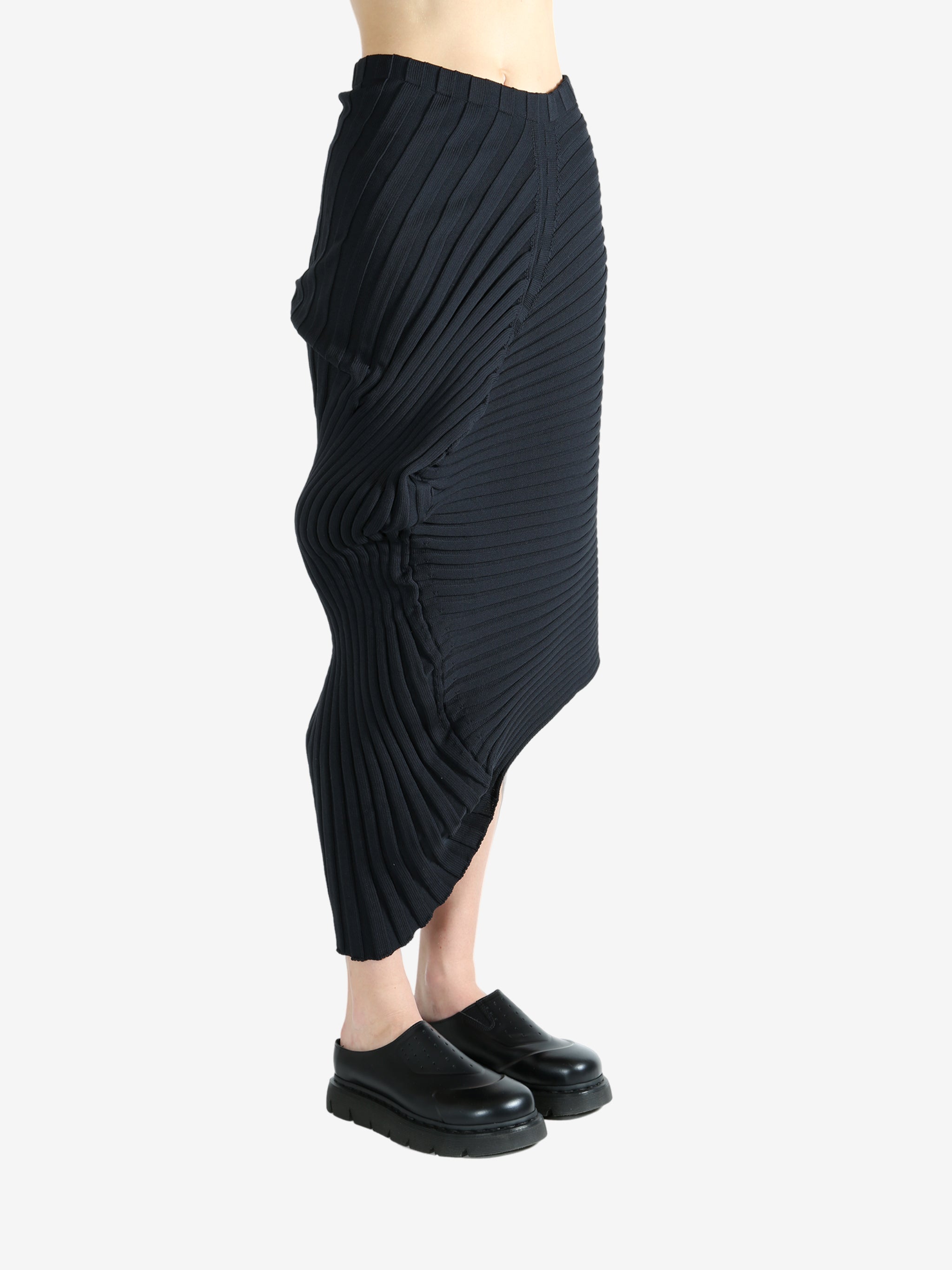 Black skirt worn by a person, showing the skirt fit