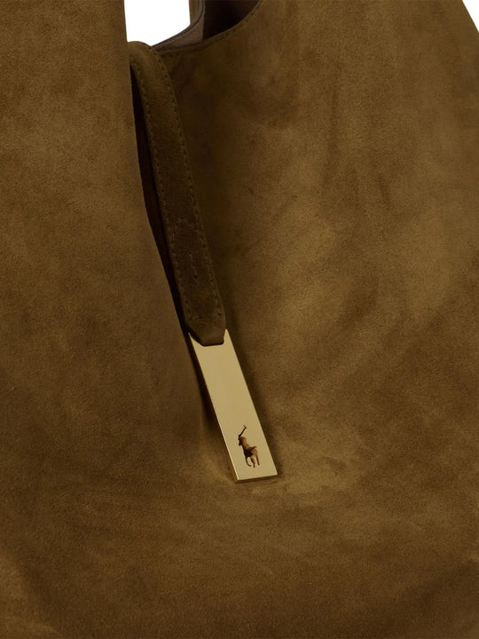 Close up of green bag, showing texture of the calf leather fabric