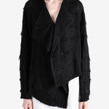 Black shirt worn by a person, showing the shirt fit