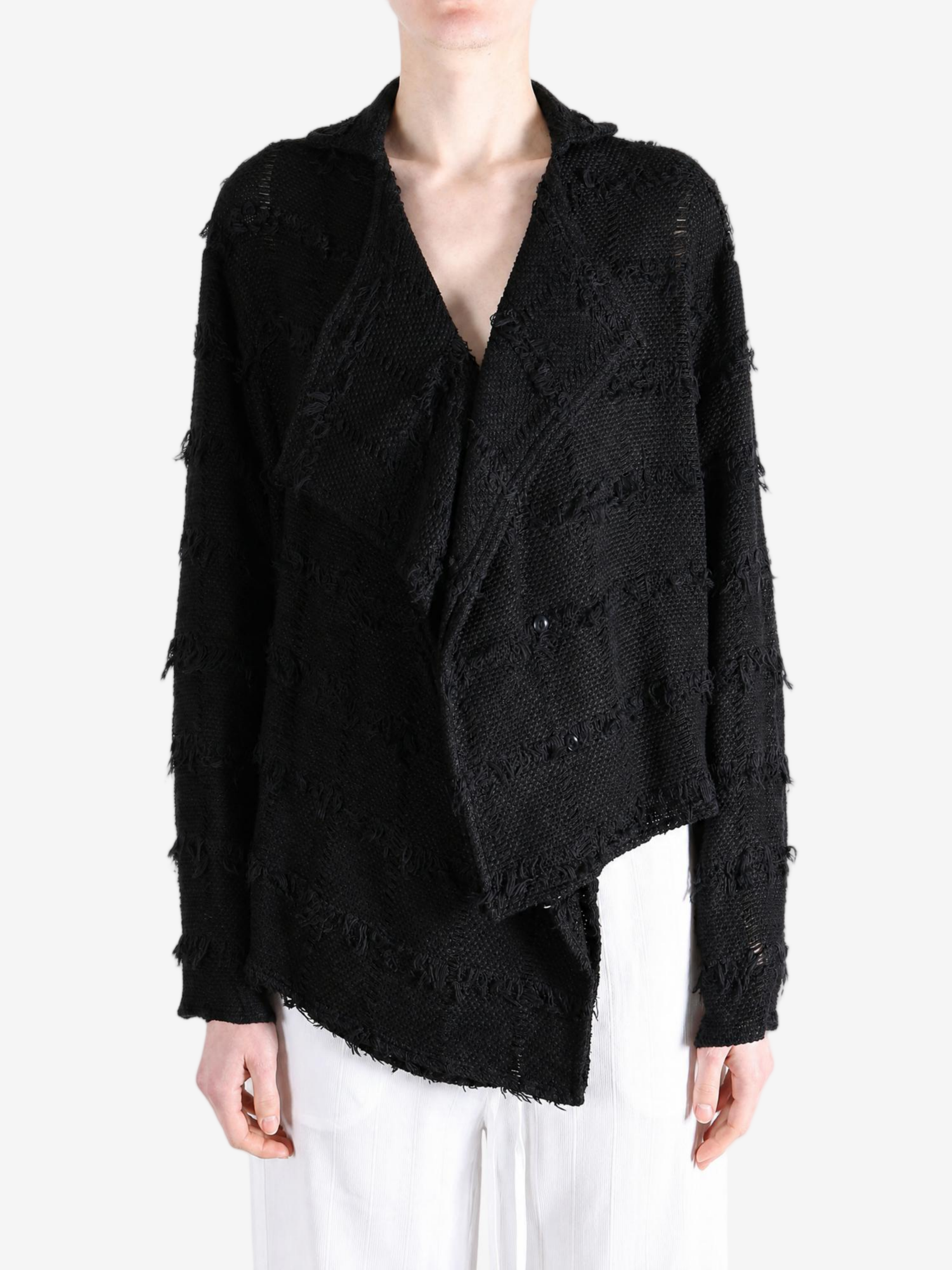 Black shirt worn by a person, showing the shirt fit