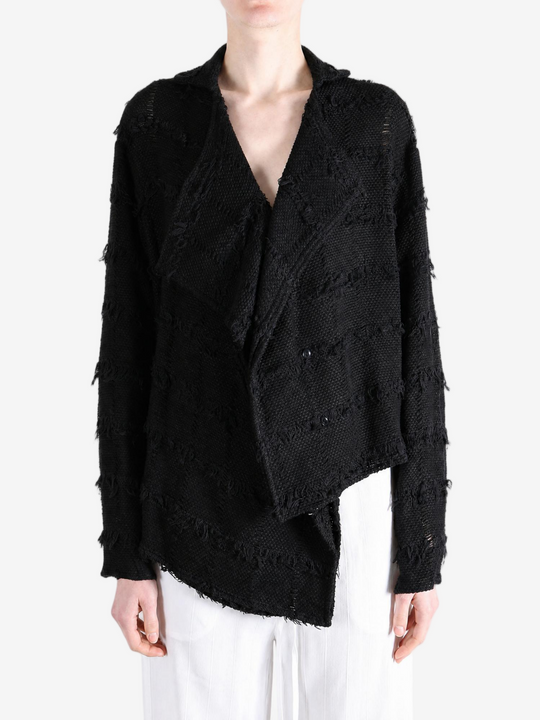 Black shirt worn by a person, showing the shirt fit